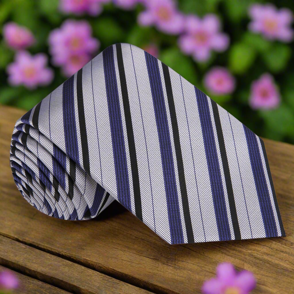 Front view of the elegant grey and black stripe silk tie, showcasing its sleek design.