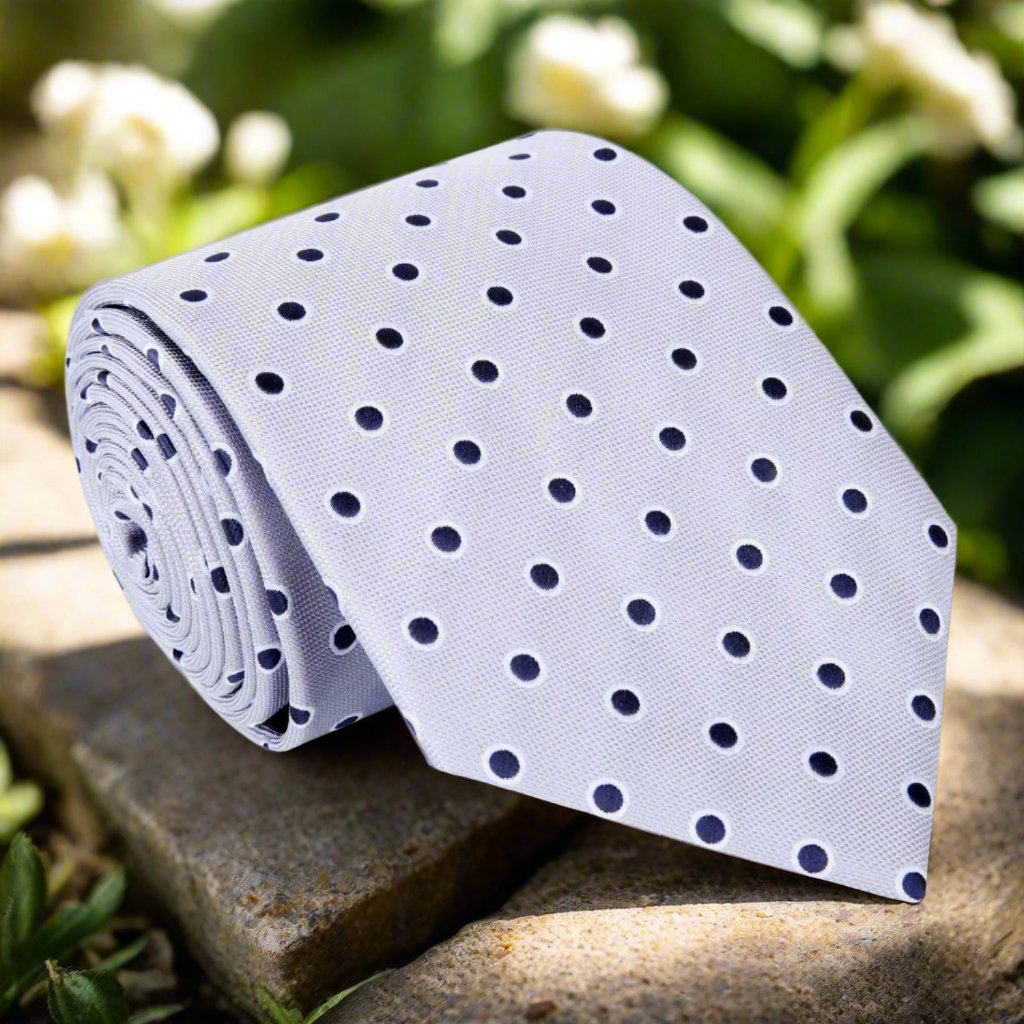 Close-up of Hercules Polka Dot Silk Tie showcasing grey and deep blue pattern