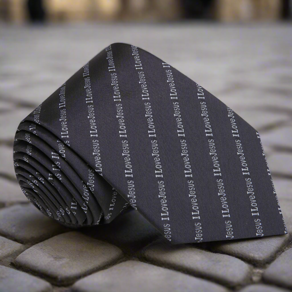Close-up of grey I Love Jesus necktie with message for faith-based fashion