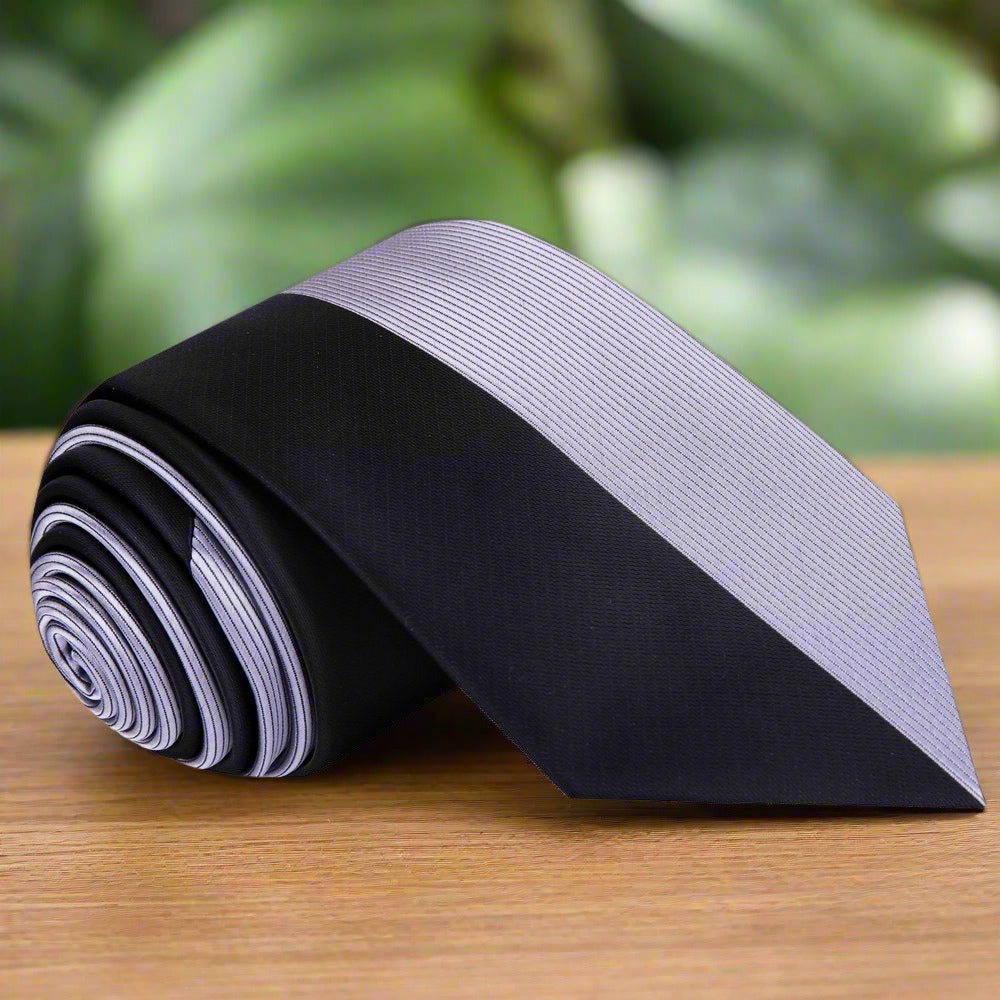 Close-up of the two-toned silk necktie showcasing the center line pattern.