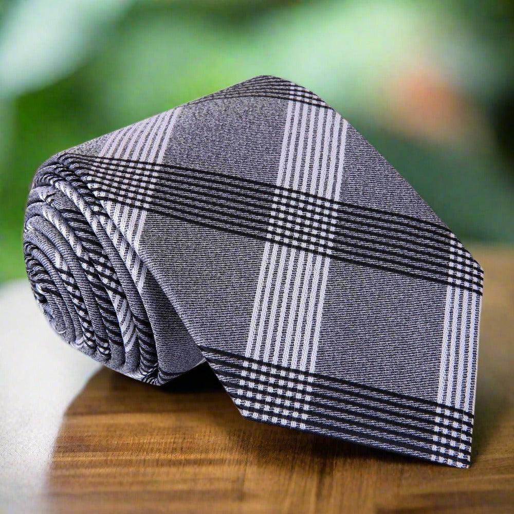 Man wearing a stylish silk tie for evening events with a white dress shirt