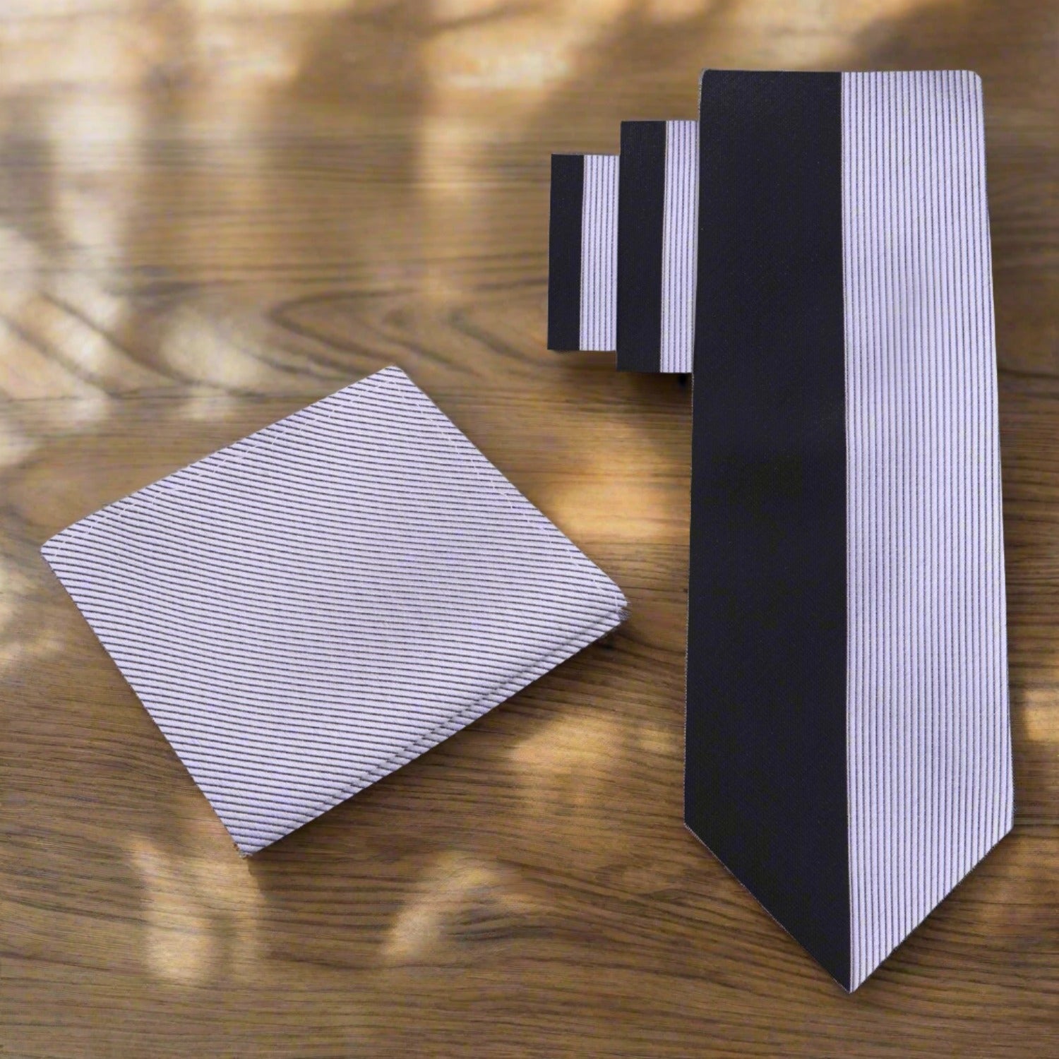 The necktie displayed against a charcoal grey suit, ideal for evening events.