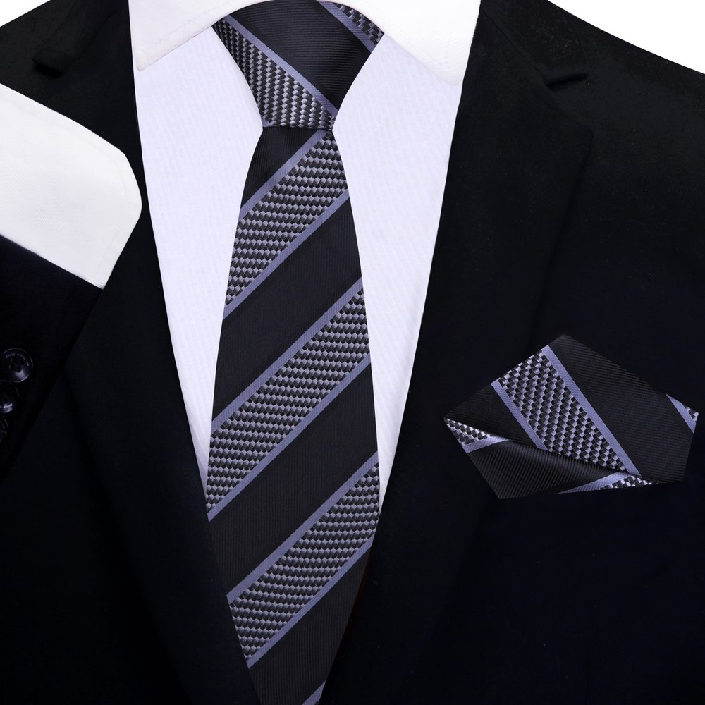 Close-up of classic striped silk necktie in blue and gold shades for business attire