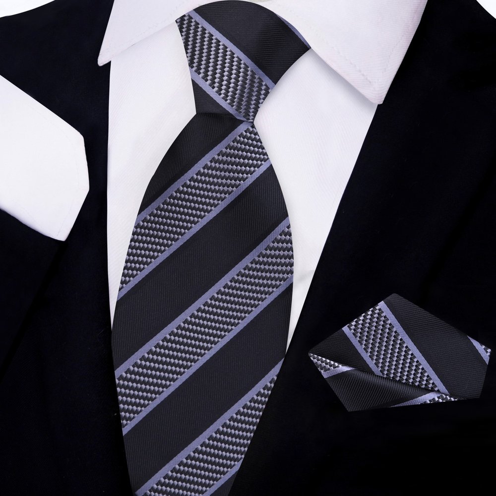 Elegant silk necktie and handkerchief set displayed on a wooden surface for networking events