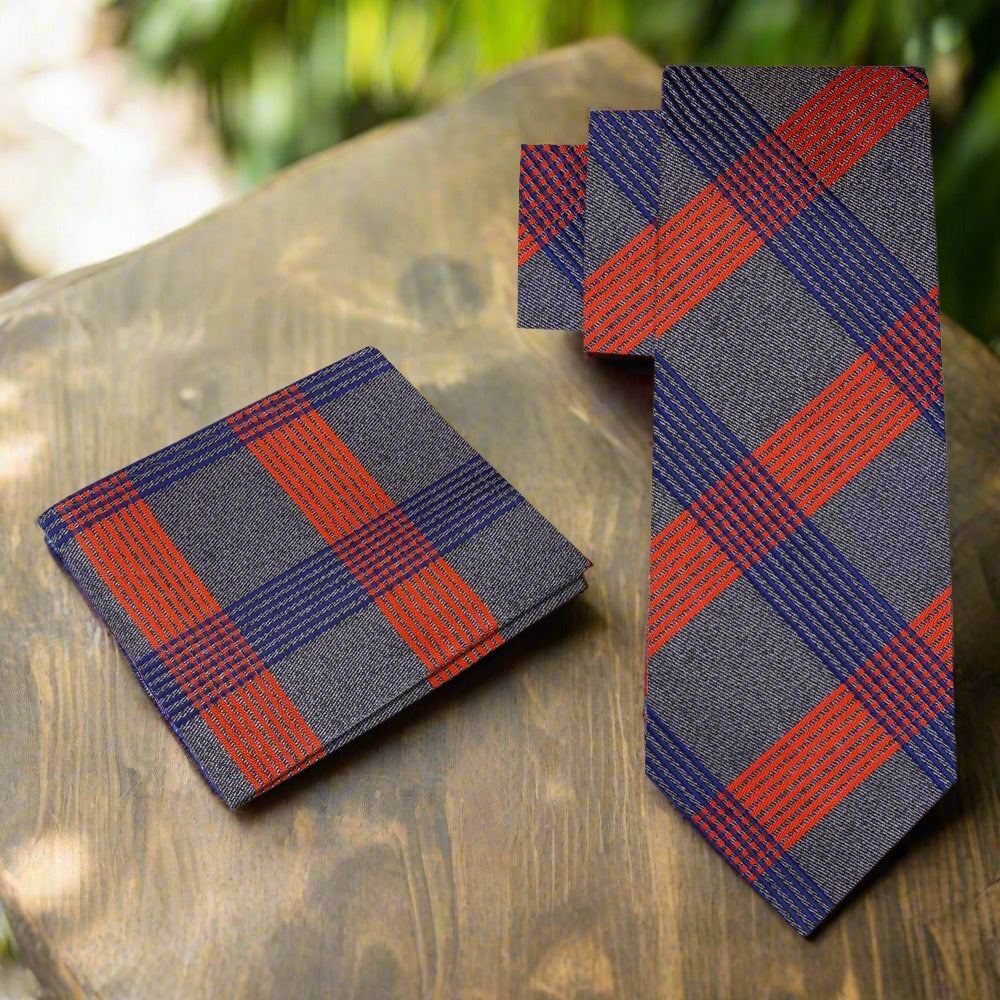 Front view of a mens silk plaid tie in grey, white, and black