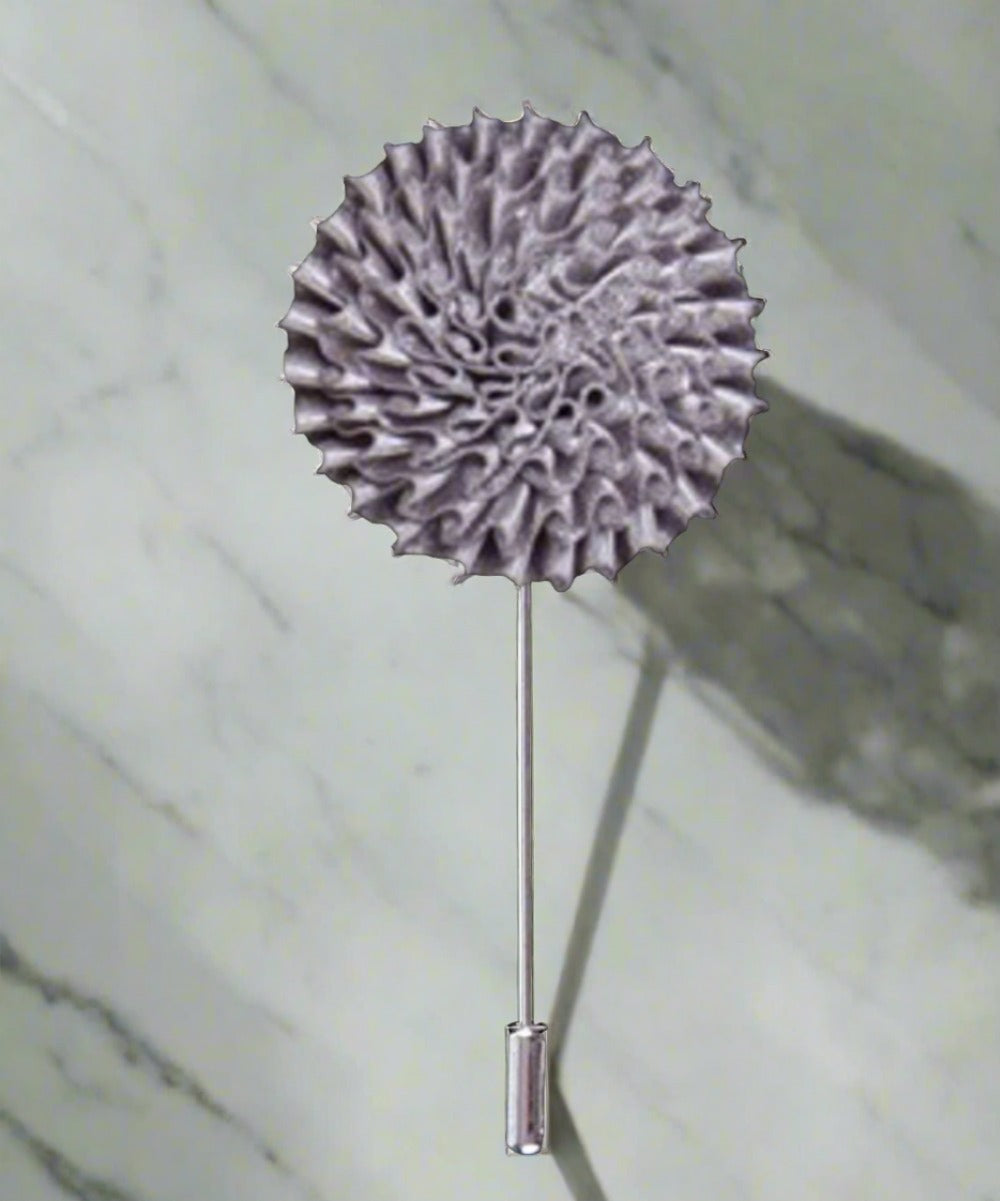 Fashion pin styled on a suit lapel with vibrant colors