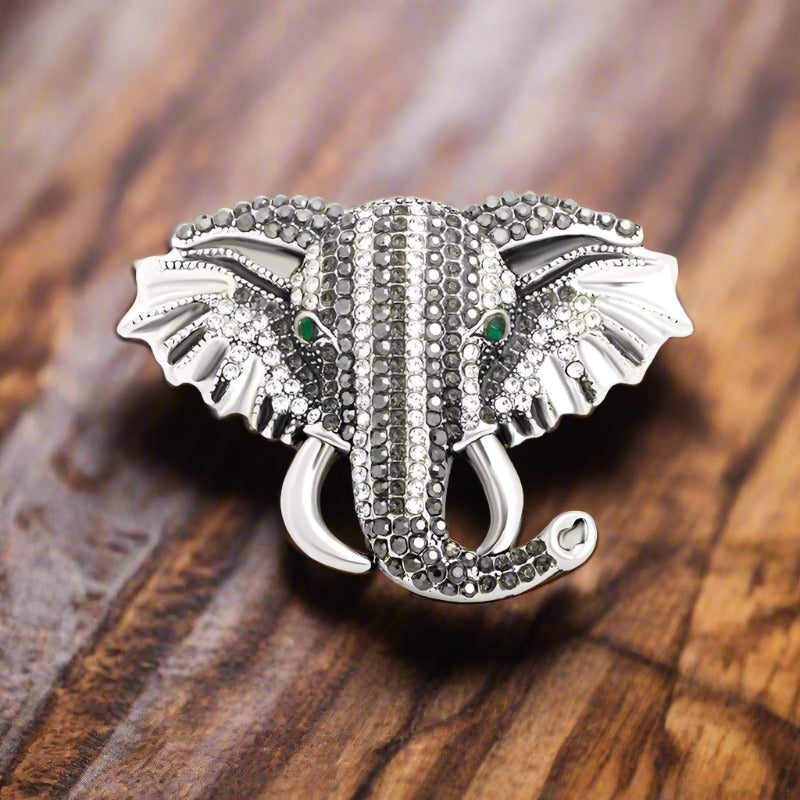 Colorful exotic animal pins with gemstones displayed for gift ideas