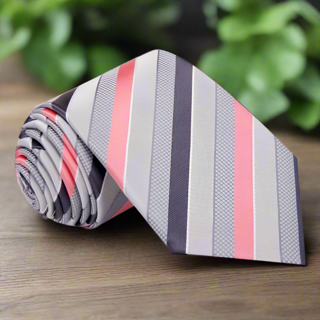 Styled shot of a grey silk tie with pink stripes perfect for weddings or business meetings