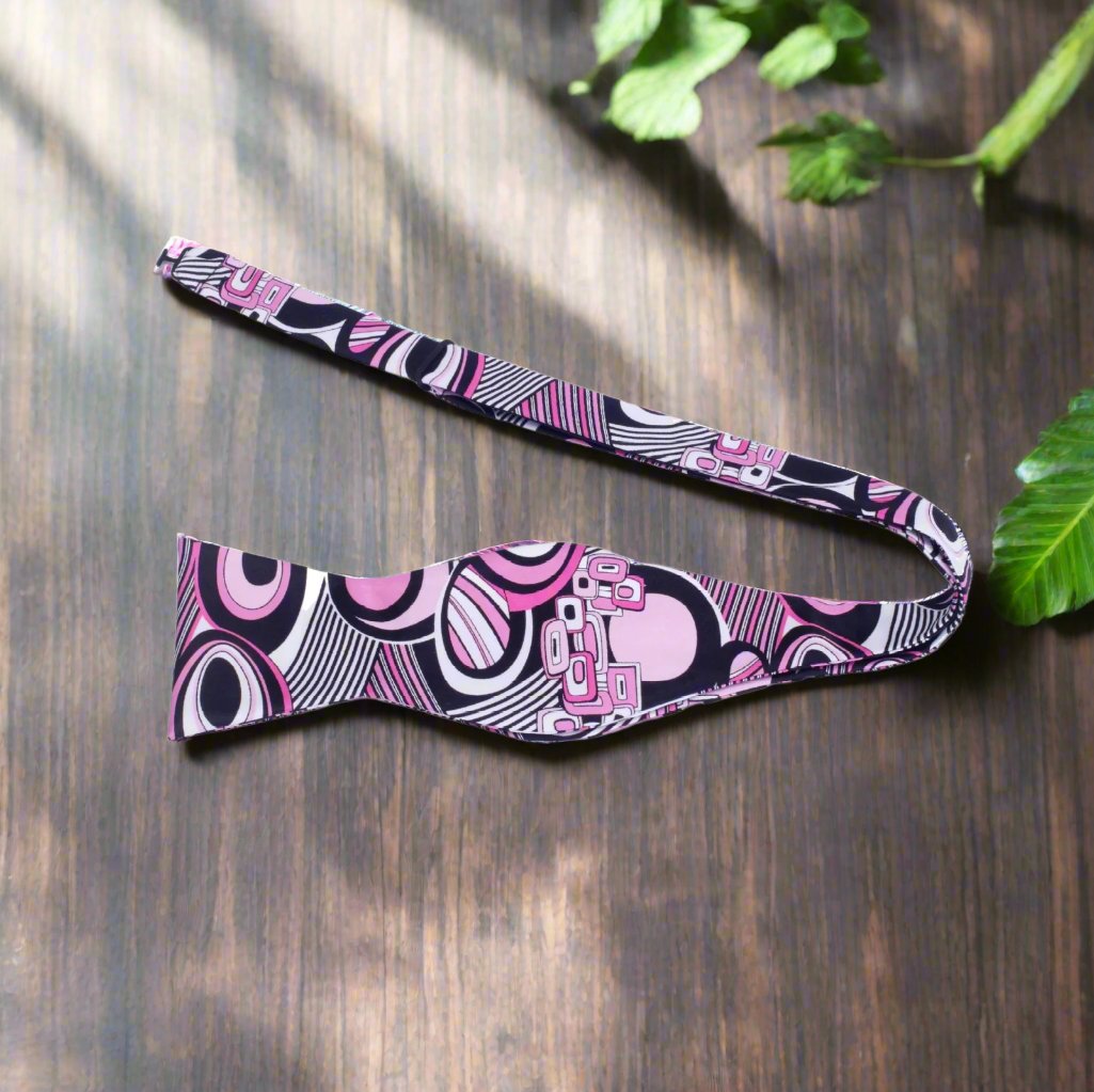 Stylish formal silk bow tie paired with a white dress shirt for a wedding or creative gathering