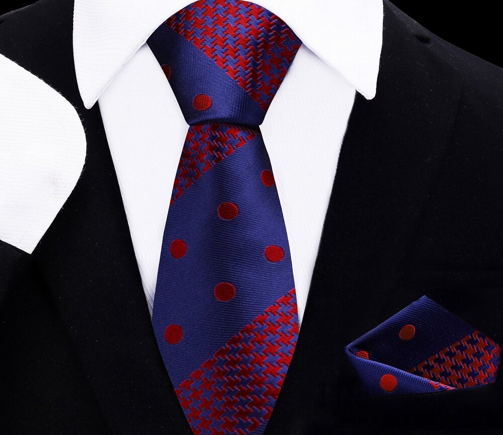 Close-up of silk kids necktie in blue and red polka dot with houndstooth pattern