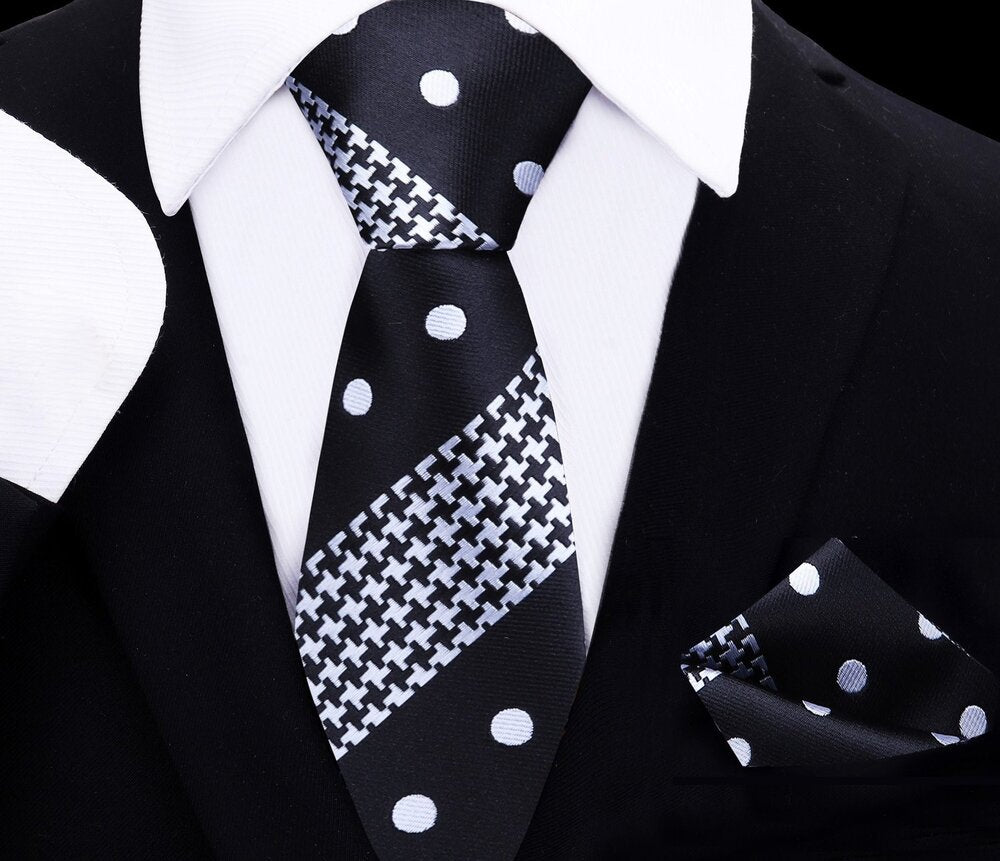 Close-up of kids silk tie and pocket square set in black with polka dots, perfect for formal wear