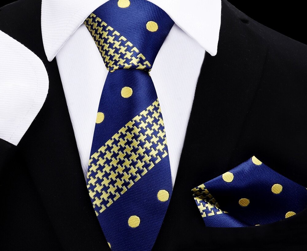 Close-up of kids silk necktie with gold polka dots and houndstooth pattern