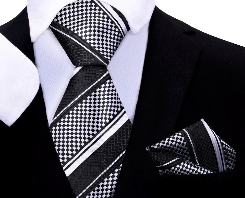 Close-up of kids silk tie and pocket square set in black and grey check pattern