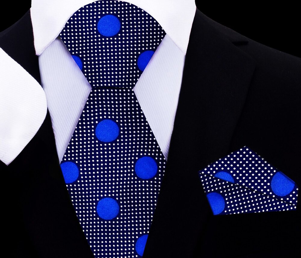 Close-up of kids navy polka dot tie with matching pocket square for formal occasions