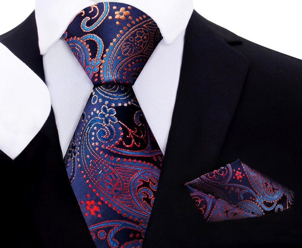 Boy wearing a silk paisley tie and pocket square for wedding