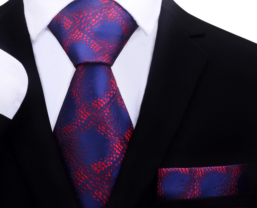 Mens tie styled with navy suit and white shirt, showcasing geometric elegance