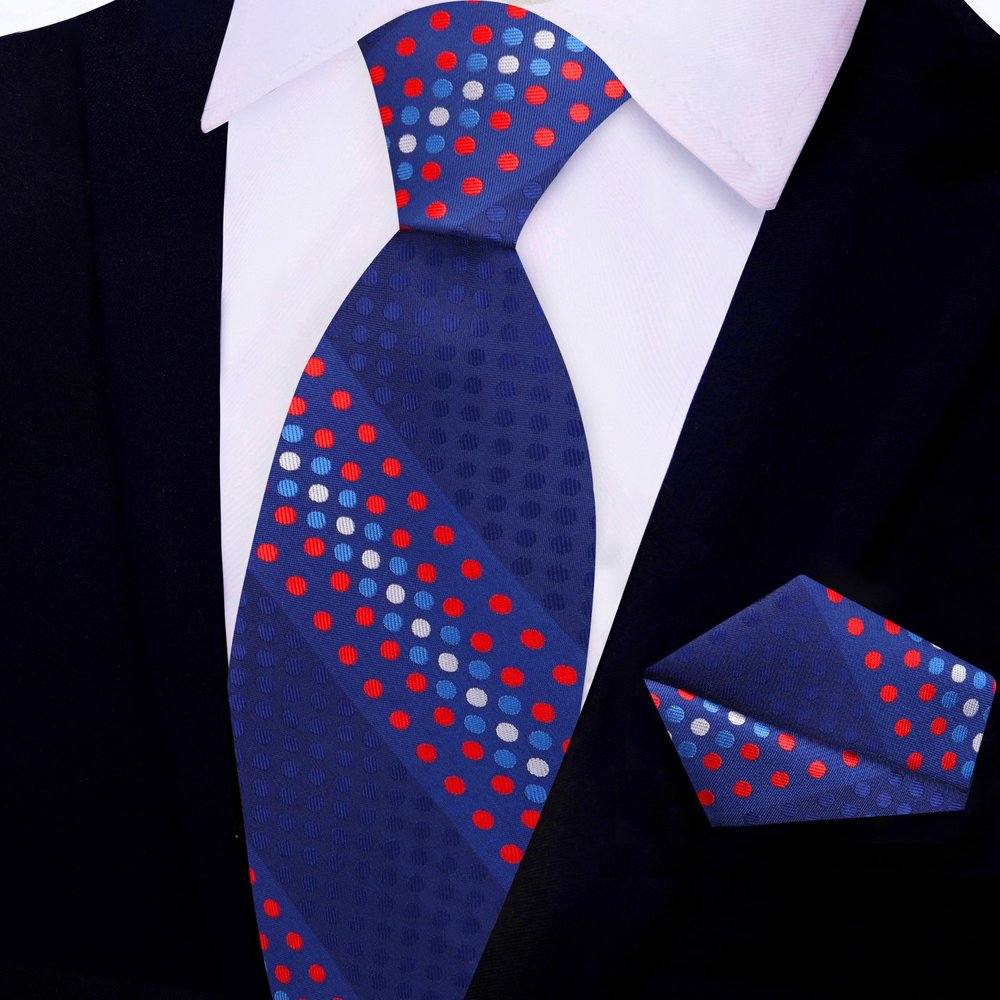 Mens silk tie with polka dot pattern paired with a navy suit