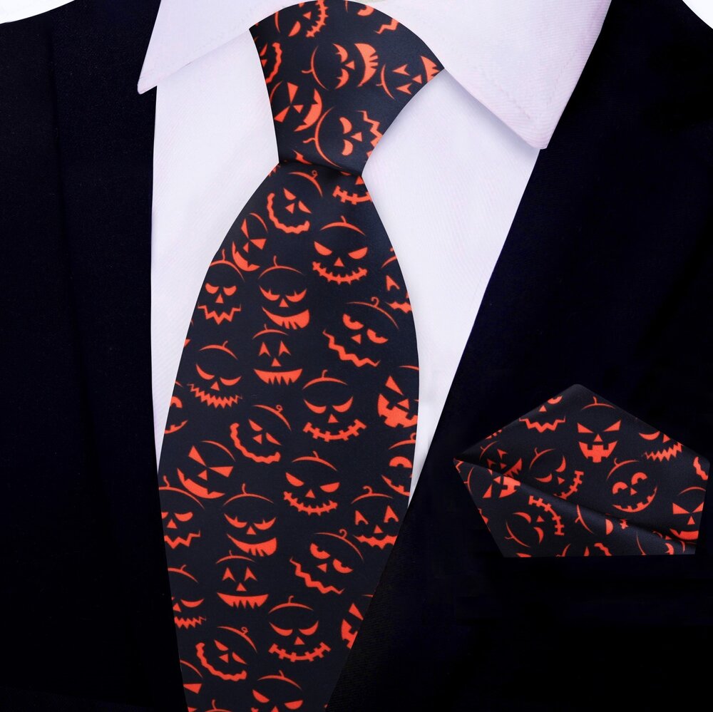 Close-up of the jack-o-lantern tie showcasing its intricate silk fabric.
