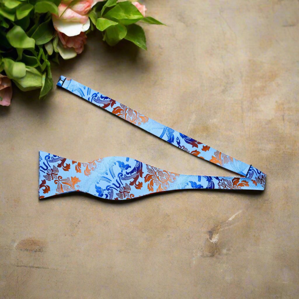 Close-up of the luxurious paisley silk bow tie showing intricate details