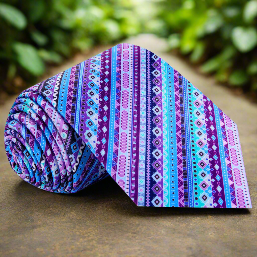 Front view of the Indigo Illusion silk necktie with abstract striped pattern in blue and purple