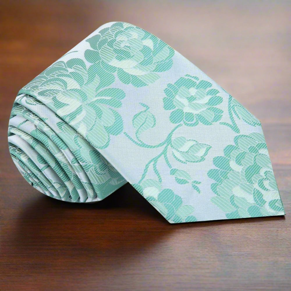Man wearing a silk tie and floral pocket square at a wedding