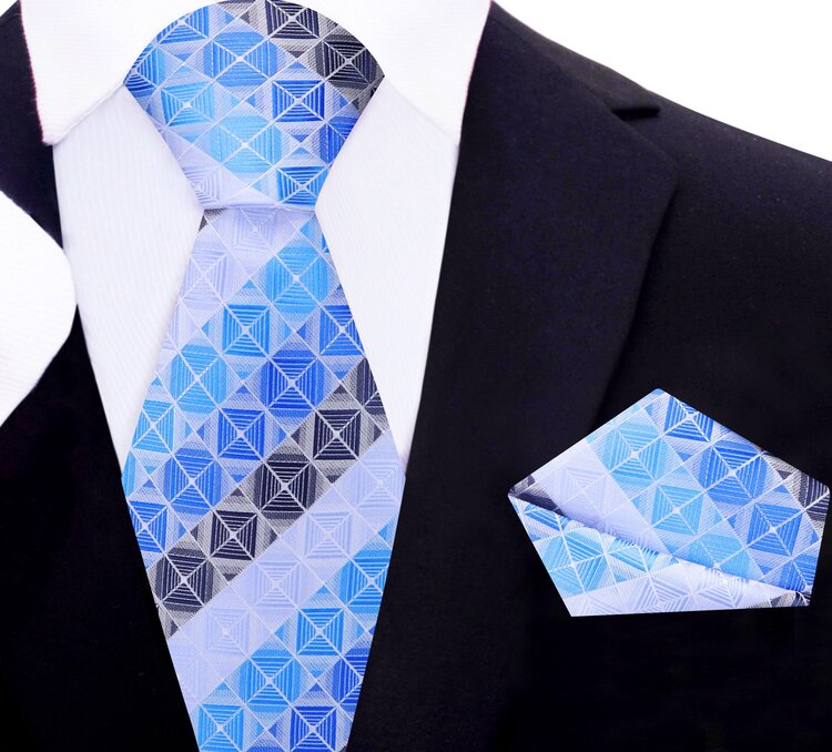 Elegant silk tie and pocket square set displayed on a flat surface, highlighting the sophisticated design for semi-formal occasions.