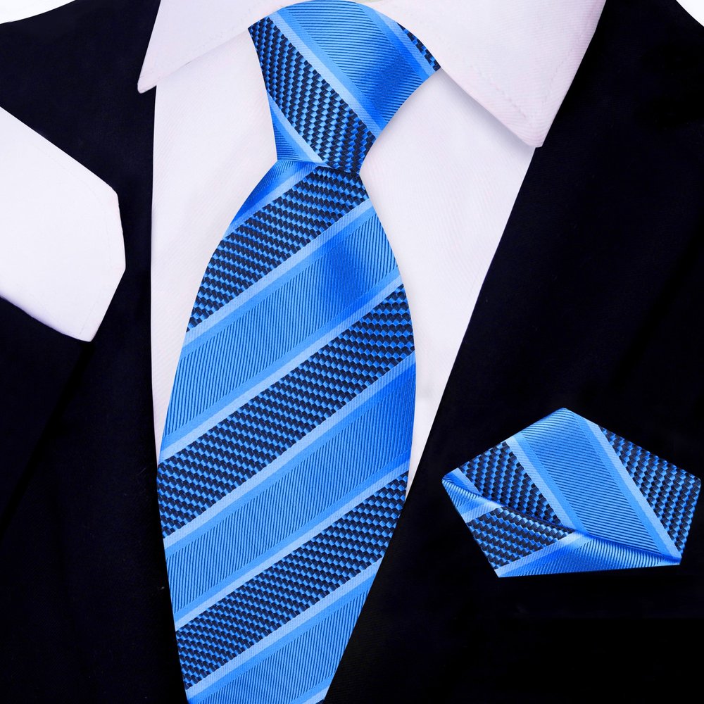 Elegant silk necktie and handkerchief set displayed on a wooden surface for networking events