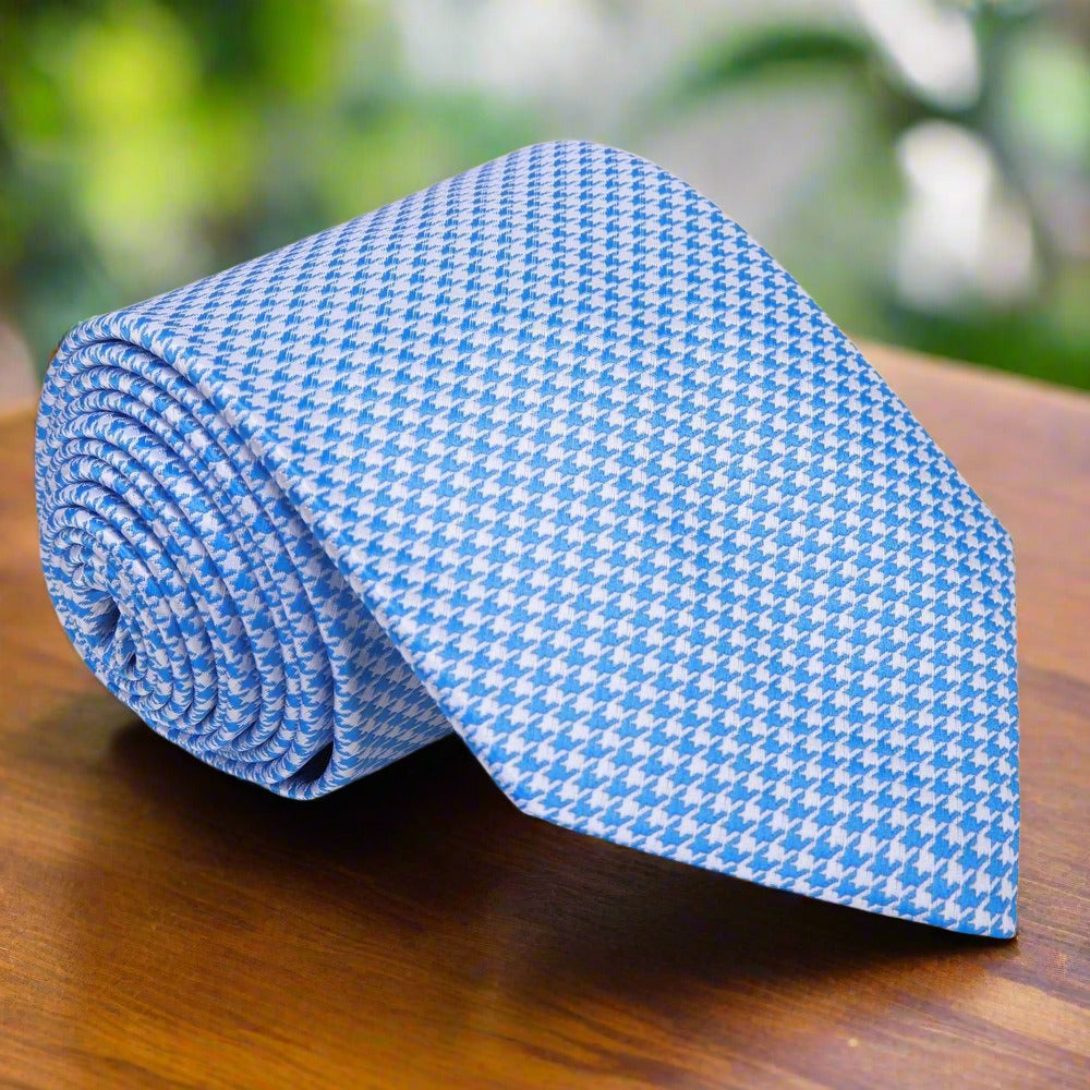 Man wearing the elegant silk necktie with a dark suit for a formal event