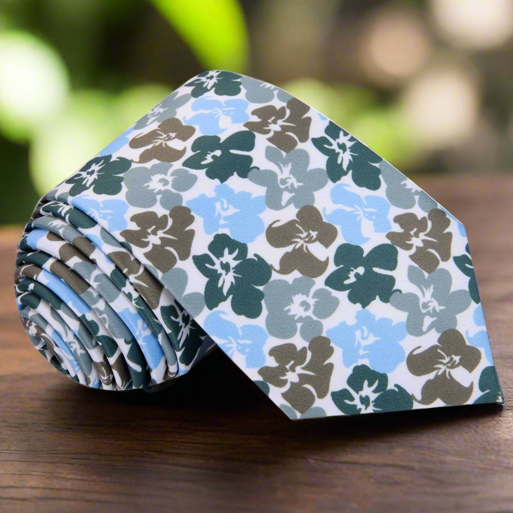Close-up of the hibiscus floral pattern on the silk tie, highlighting the intricate details and rich colors.