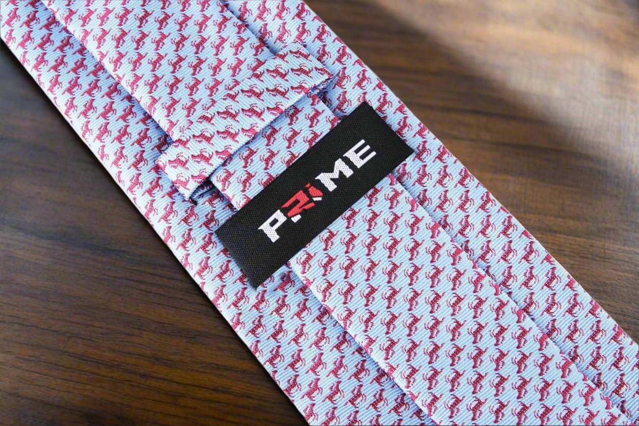 Necktie styled with a light blue dress shirt, enhancing its equestrian theme.