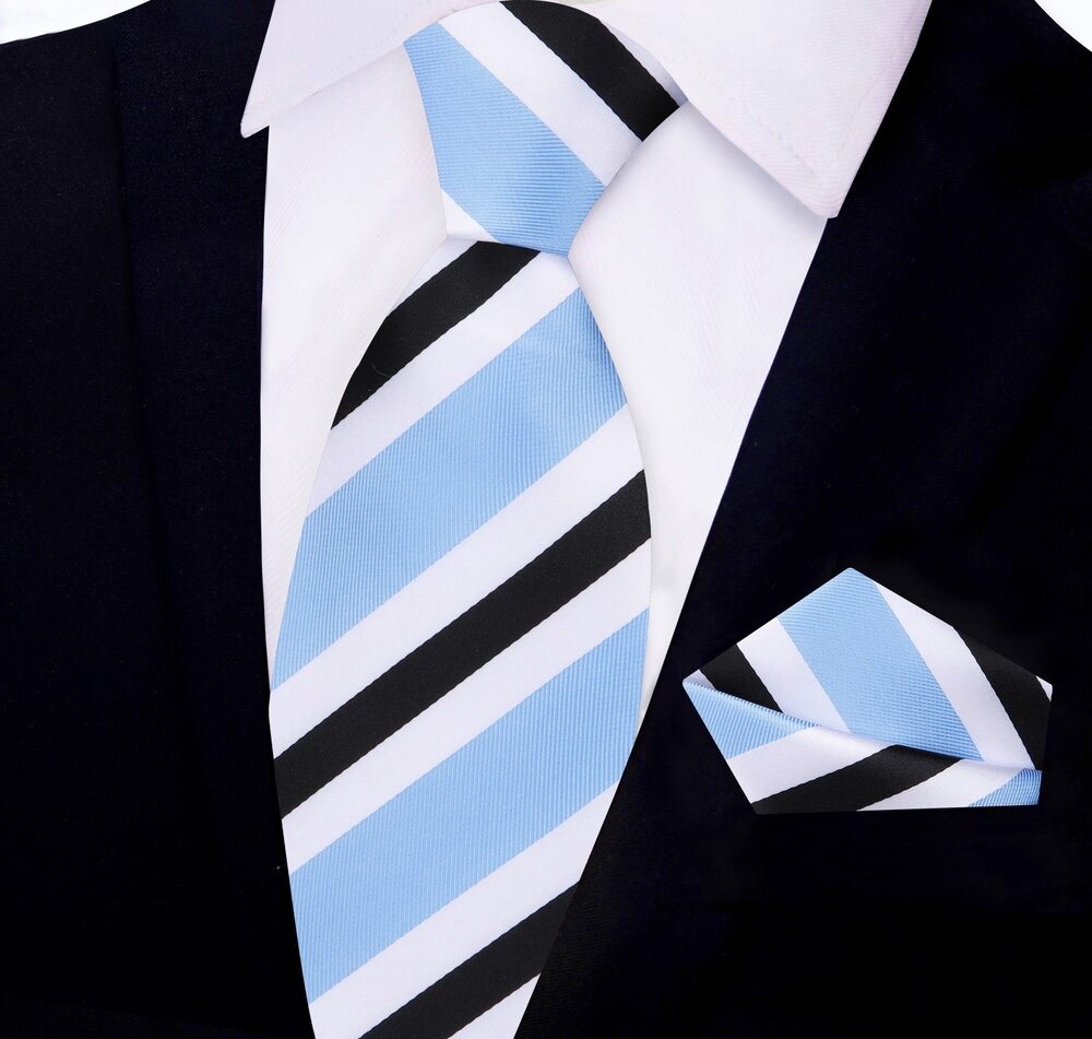 Man wearing a silk necktie and pocket square set with a dark grey suit