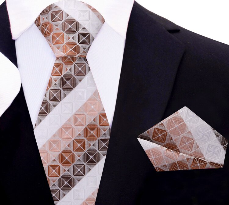 Elegant silk tie and pocket square set displayed on a flat surface, highlighting the sophisticated design for semi-formal occasions.