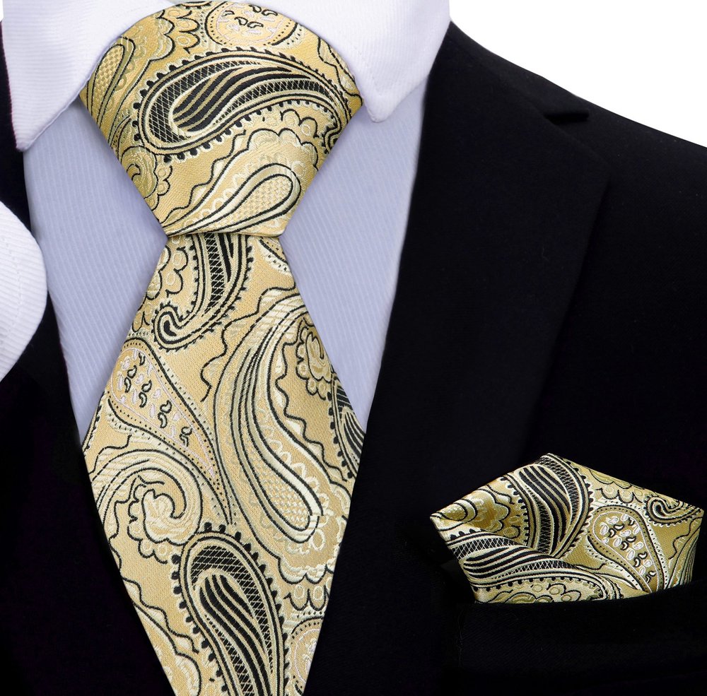 Mens tie styled with a navy suit and white dress shirt, demonstrating a polished look for business meetings.