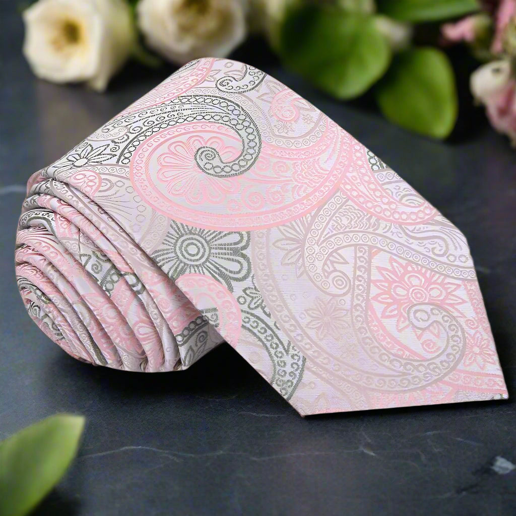 Close-up of silk paisley tie in pink and olive green for formal wear