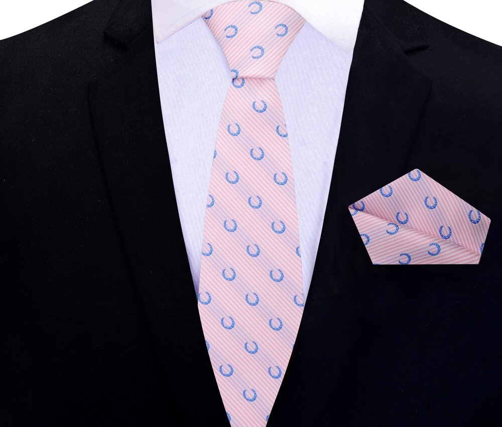 Fashionable mens silk tie with playful horseshoe motif paired with dress shirt