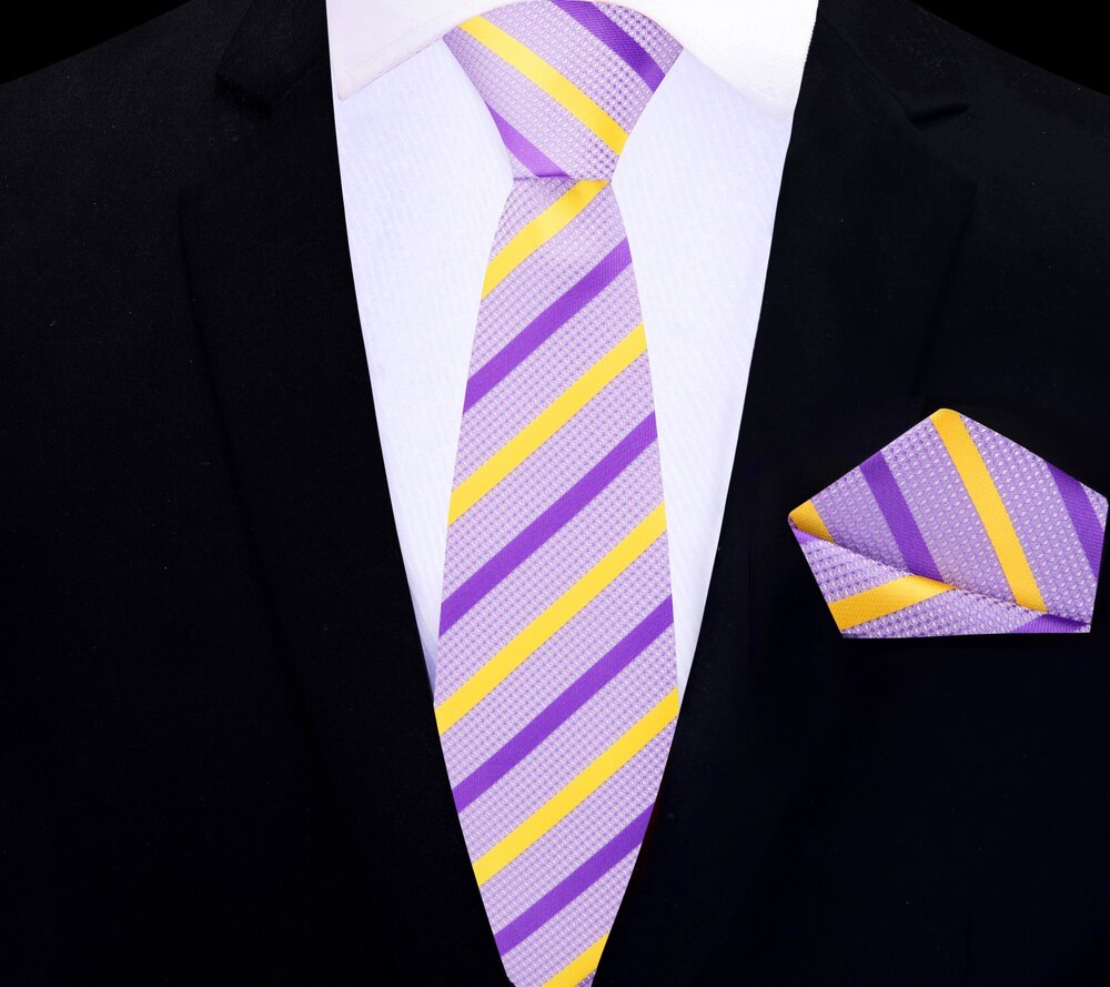 Fashionable mens tie with yellow stripes paired with a navy suit