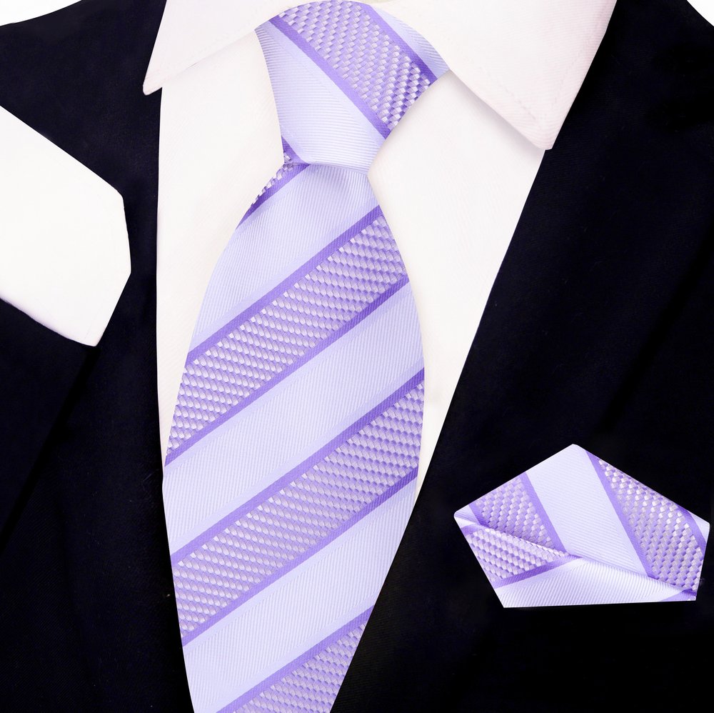 Close-up of classic striped silk necktie in blue and gold shades for business attire