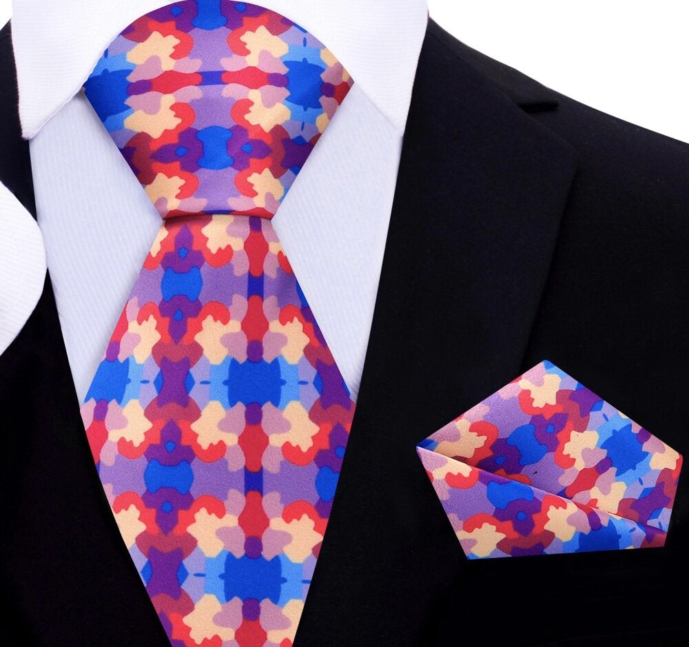 Folded view of handmade watercolor tie with pocket square — styled for art exhibits and events.