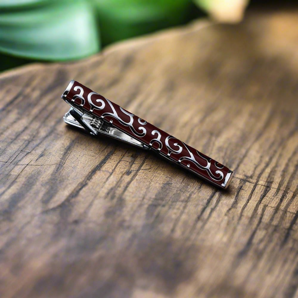 Gold checkerboard tie bar, adding a touch of modern elegance to mens dress accessories.