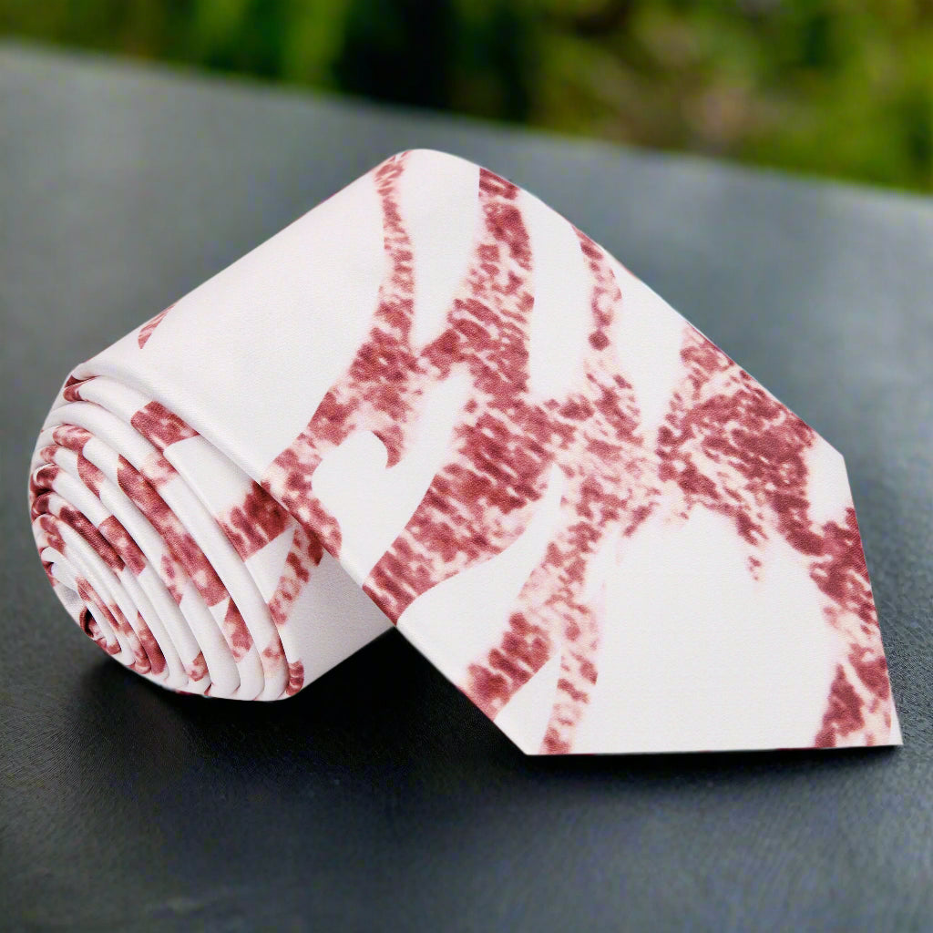 Close-up of rose gold marble tie on white shirt—highlighting silk texture and shimmer