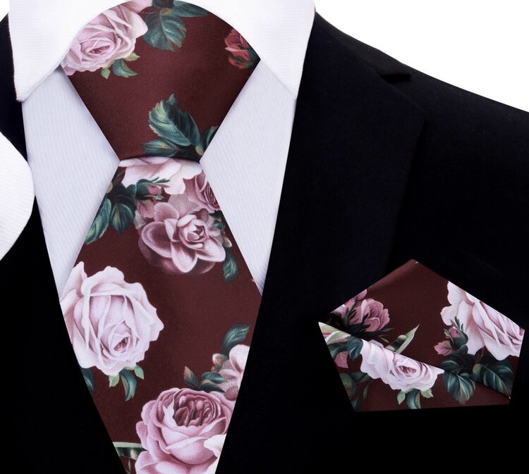 Close-up of the floral print necktie, highlighting the vibrant pink roses against a rainy day gray background.