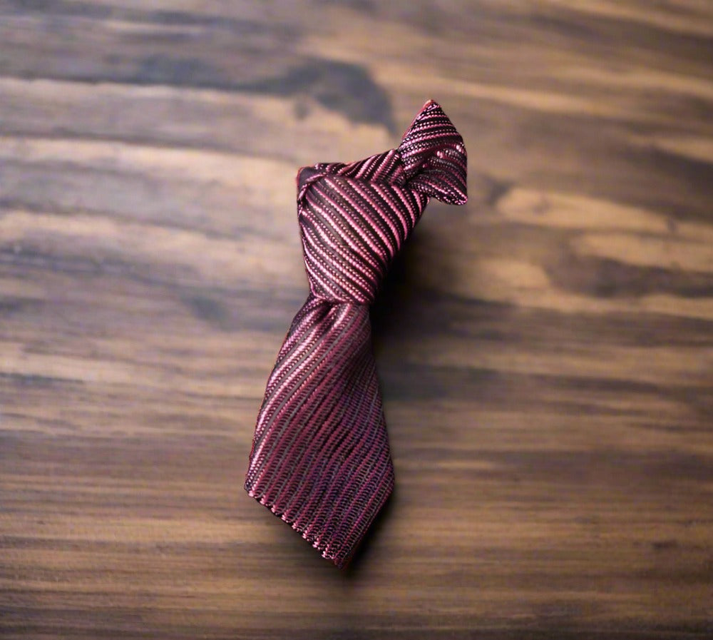 Charming necktie lapel pin displayed on a white dress shirt, showcasing its unique design.