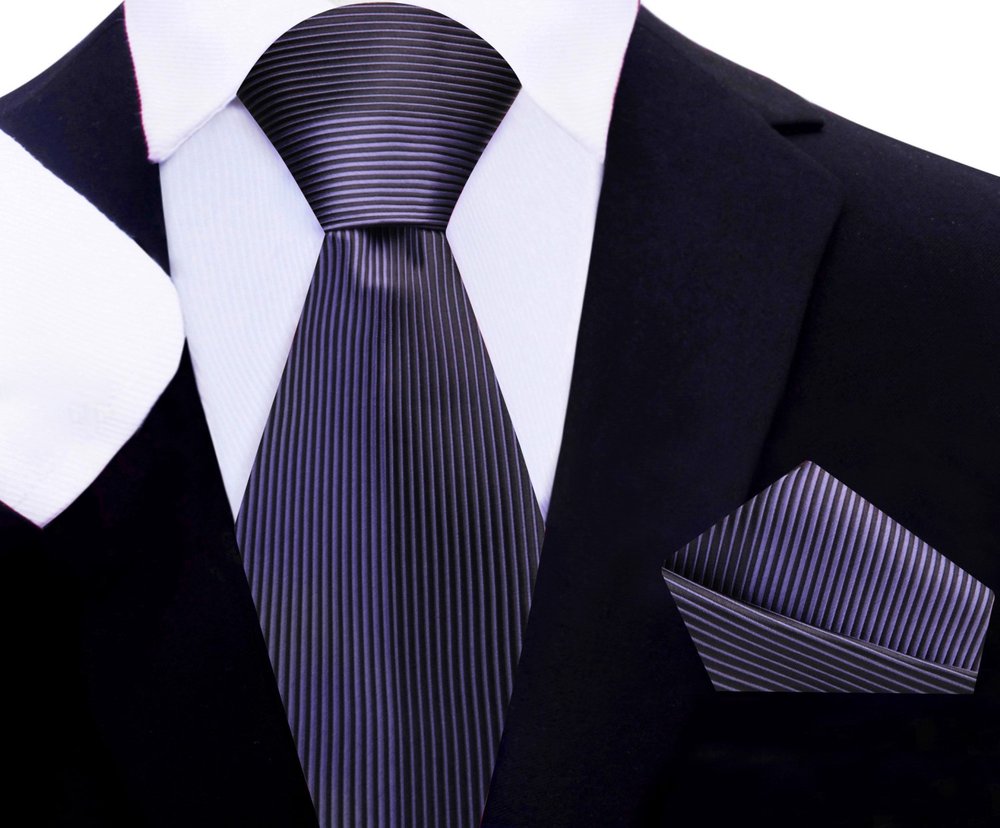 Black silk necktie with metallic purple stripes styled with a suit.