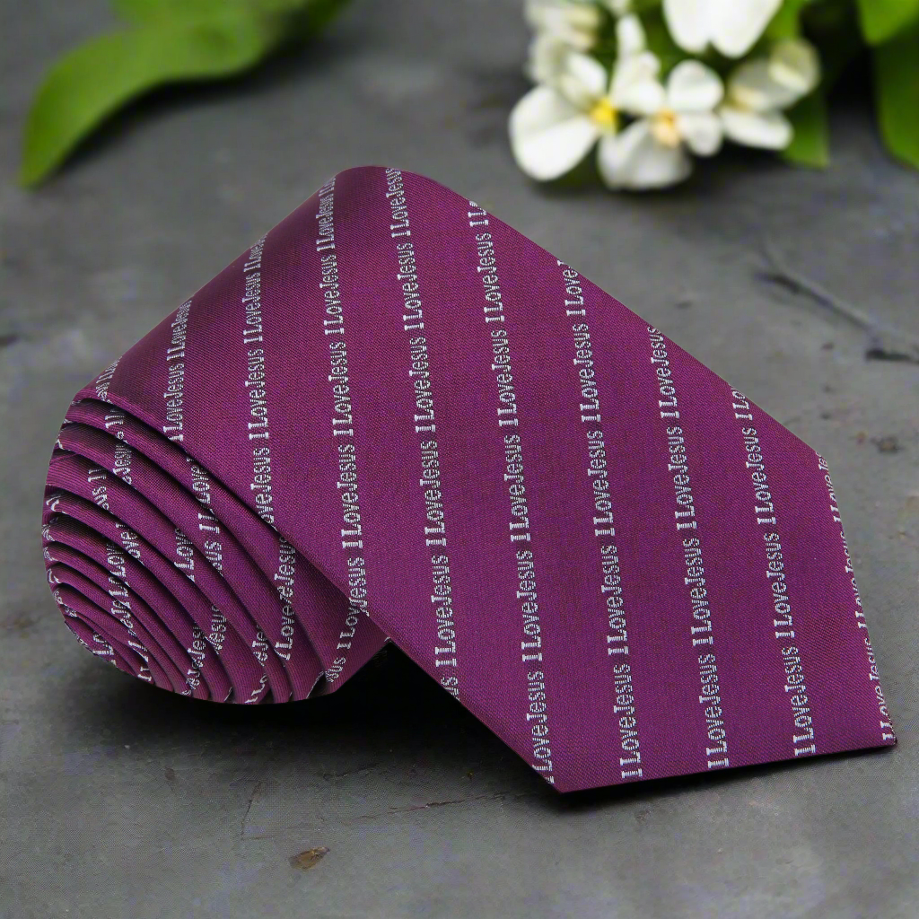 Close-up of faith-themed men's tie with 'I Love Jesus' message, suitable for church attire