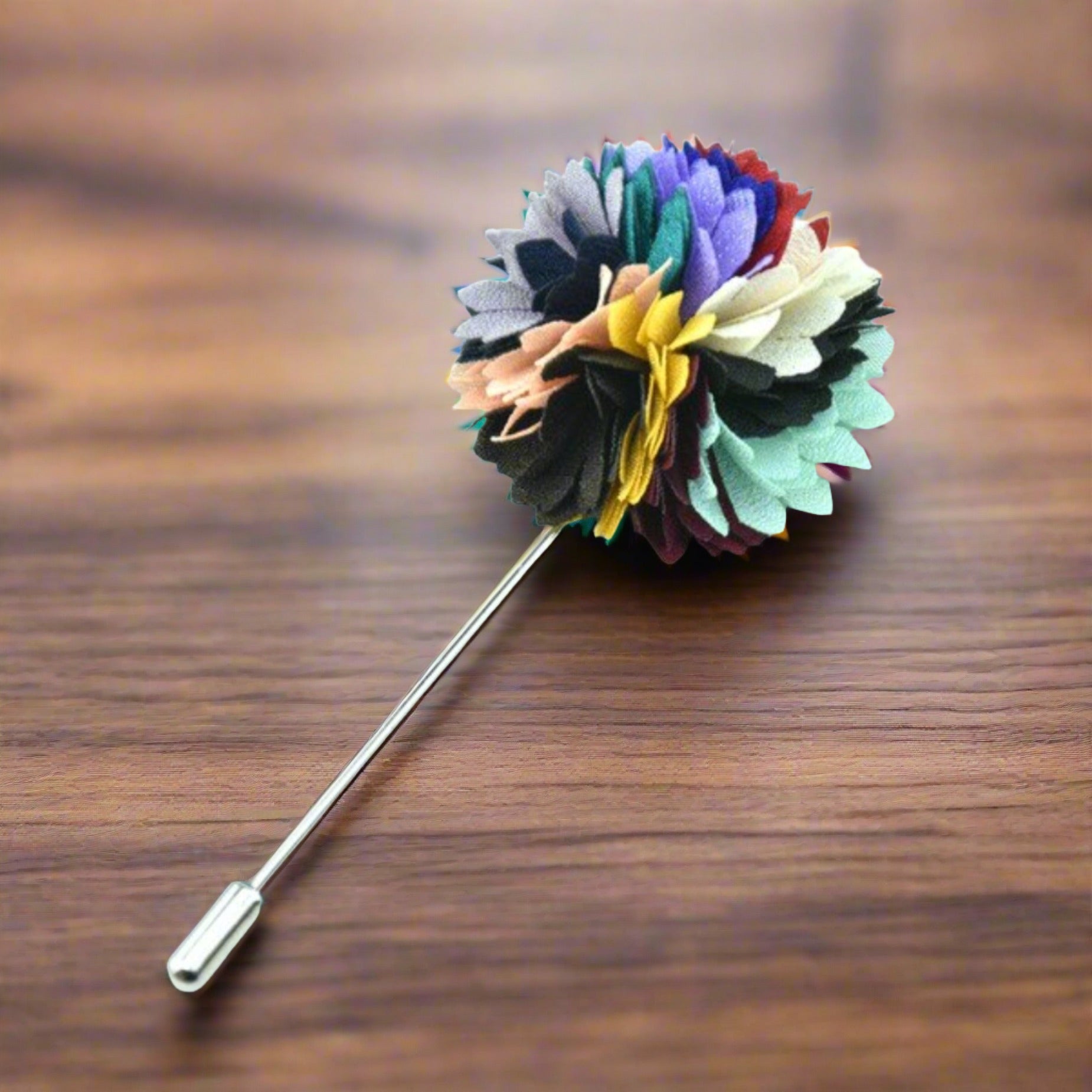 Close-up of men's flower petal lapel pin in red and black, showcasing intricate petal design.