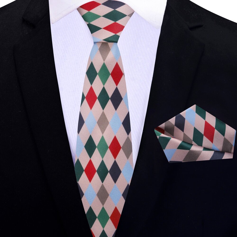 Stylish man pairing Christmas diamond necktie with navy suit for winter event