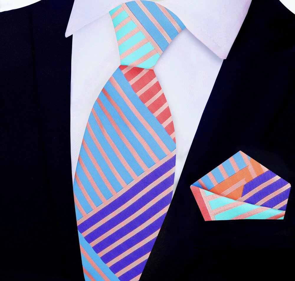 Styled image of the silk tie paired with a white dress shirt and navy suit