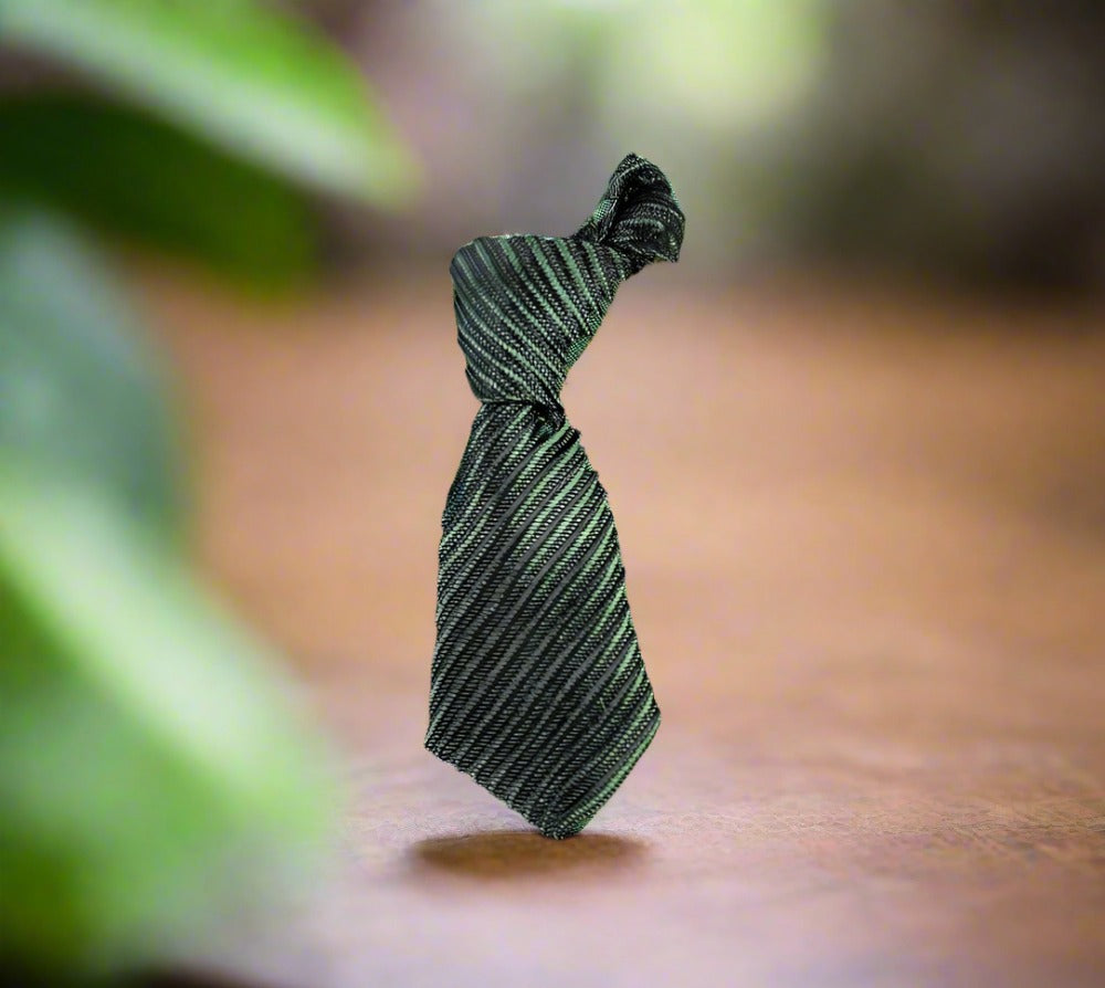 Necktie lapel pin paired with a navy blue suit, adding a sophisticated touch.