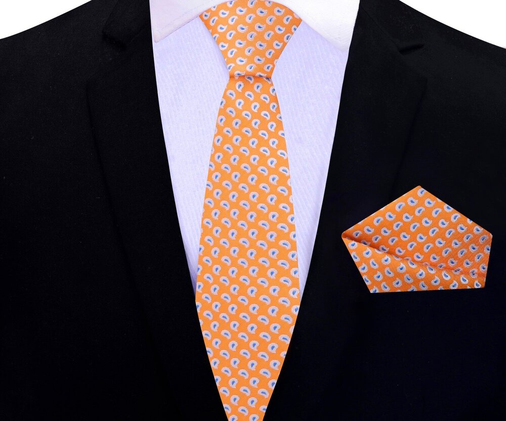 Man wearing paisley silk necktie with a navy suit at a wedding event
