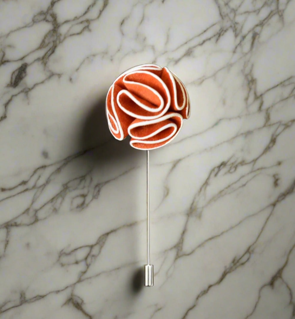 Elegant custom flower lapel pin displayed on a suit jacket.